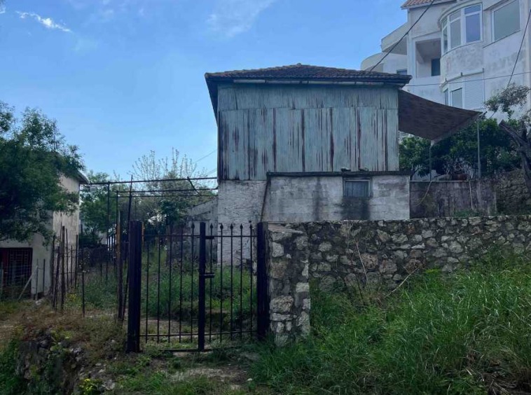 View of the Fryni Detached House Lefkada, showcasing its traditional structure and potential for renovation.