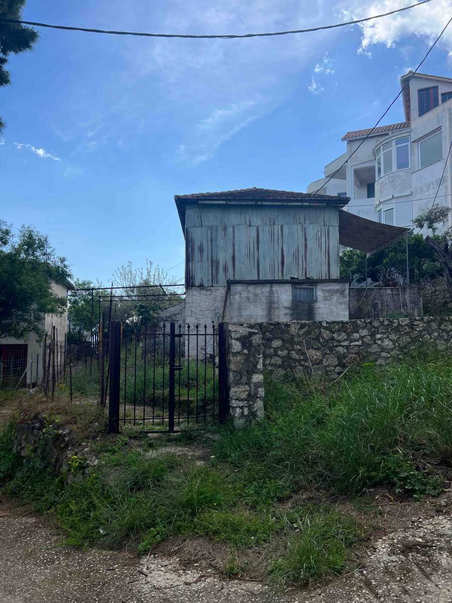 View of the Fryni Detached House Lefkada, showcasing its traditional structure and potential for renovation.