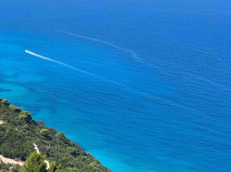 Spectacular beach view from the balcony of the Tsoukalades Beachview Apartment, showcasing the serene and picturesque coastline.