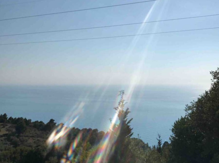 Sweeping landscape of Athani Porto Katsiki Land in Lefkada, showcasing its expansive sea views and ideal building terrain.