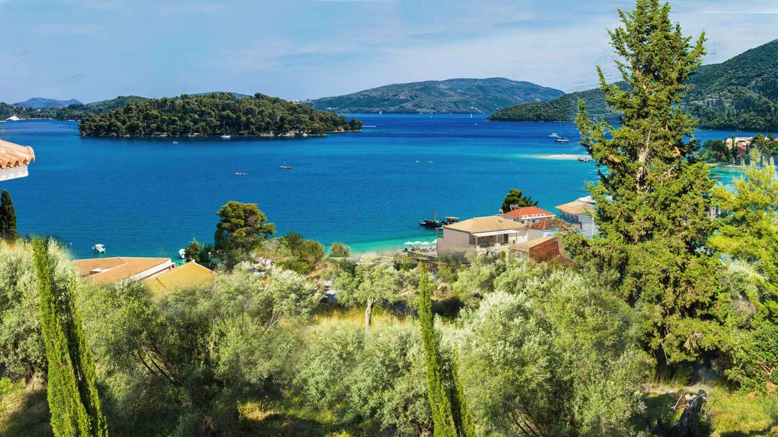 Panoramic view of Perigiali from the hilltop, available in our Lefkada Real Estate Listings
