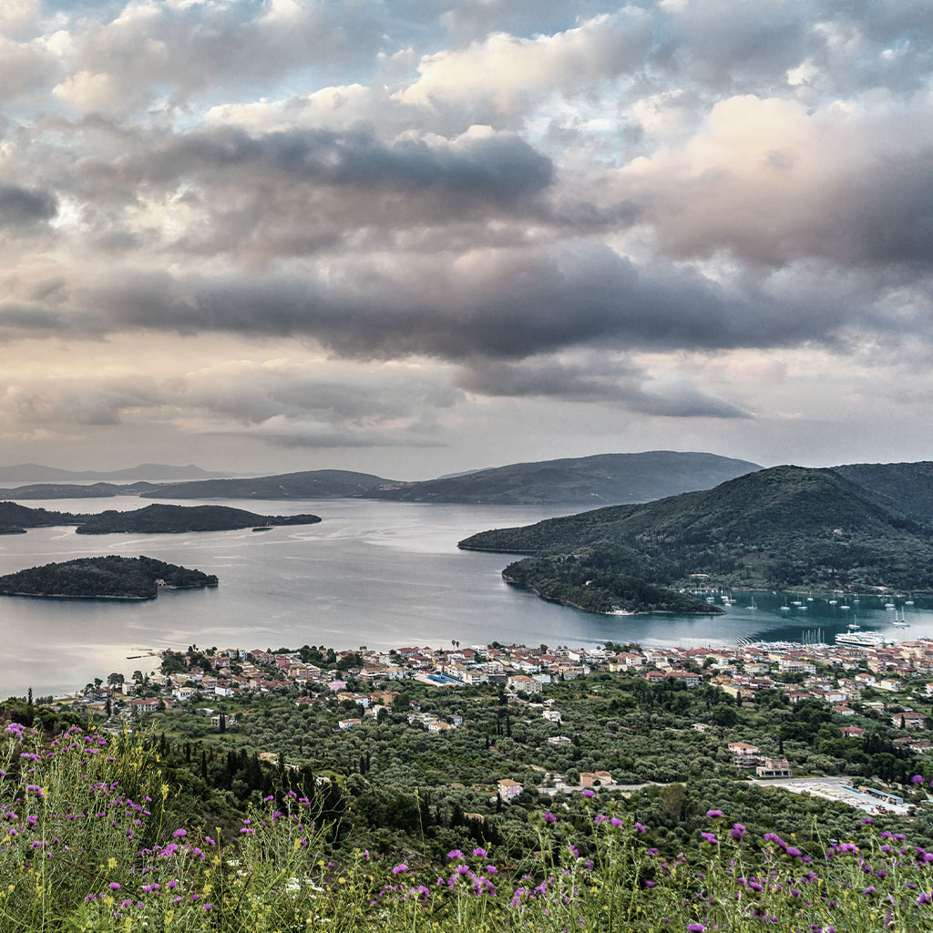 Sweeping view of nearby islands from a Lefkada mountain, relevant to Real Estate Prices in Lefkada