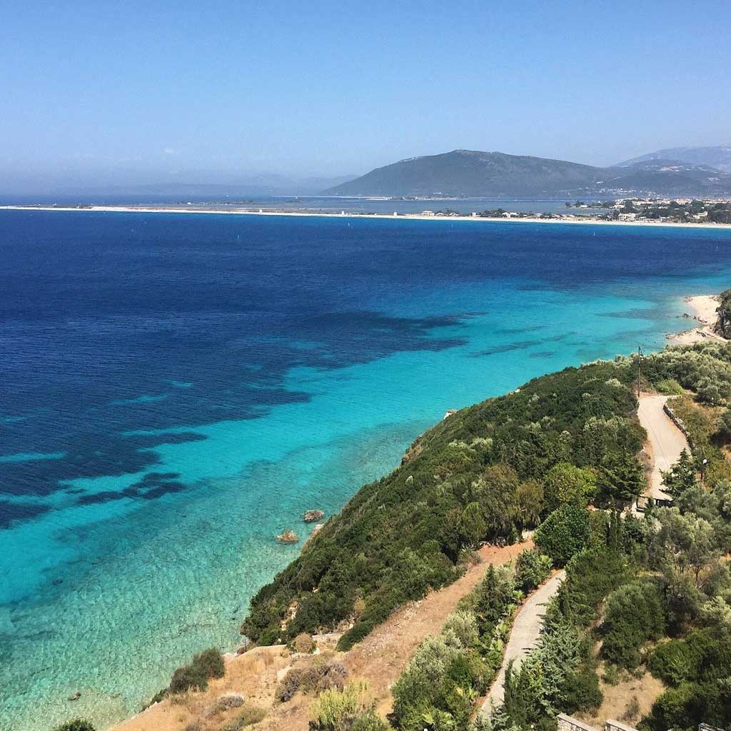 Panoramic view of Tsoukalades, showcasing land for sale in Tsoukalades with picturesque hills rolling down to the crystal-clear beaches.