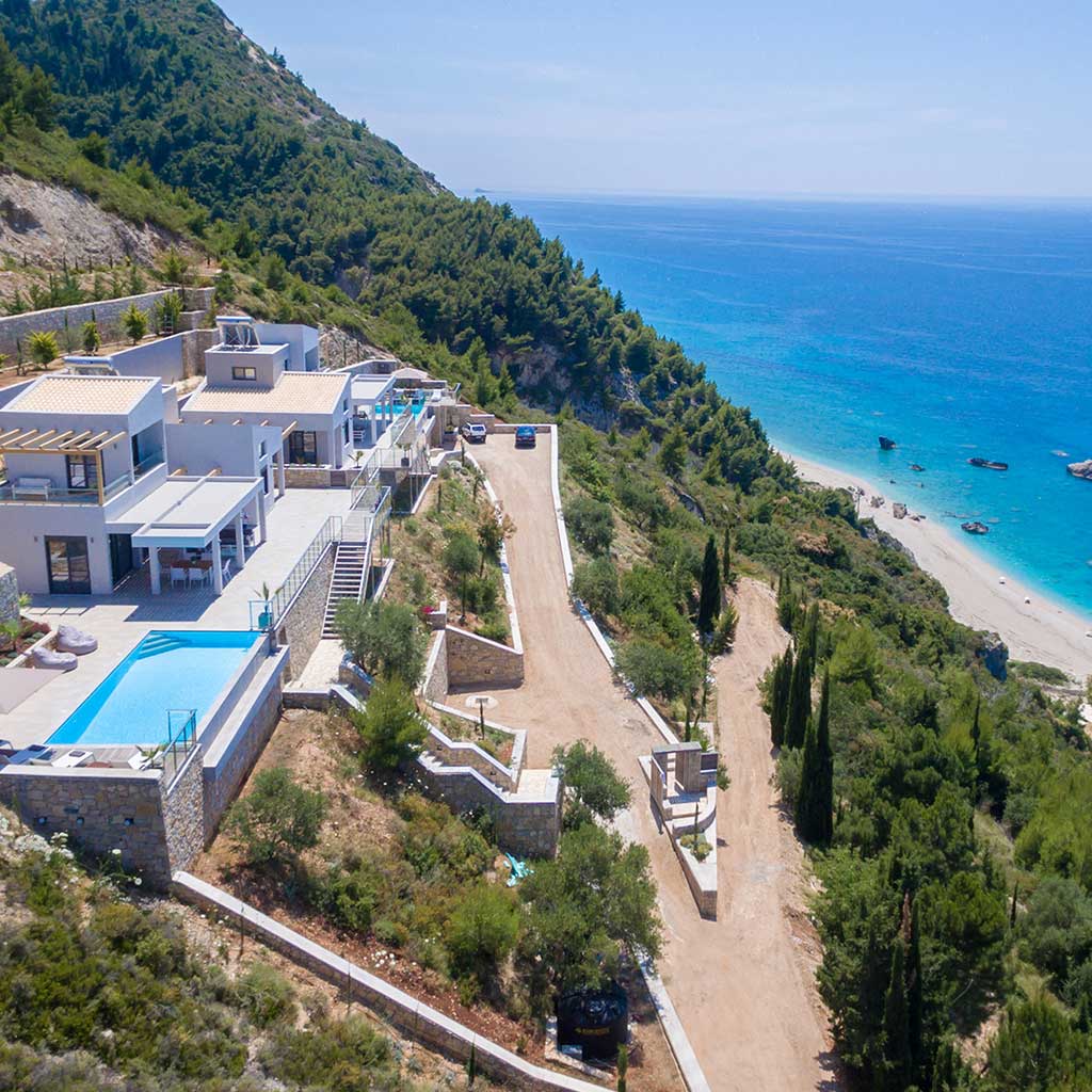A luxurious villa perched by the pristine beach of Kathisma, showcasing the potential of land for sale Kathisma Lefkada.