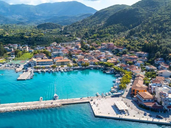 A breathtaking view of the serene beach in Vasiliki, Lefkada, showcasing the potential of the available land for sale in Vasiliki