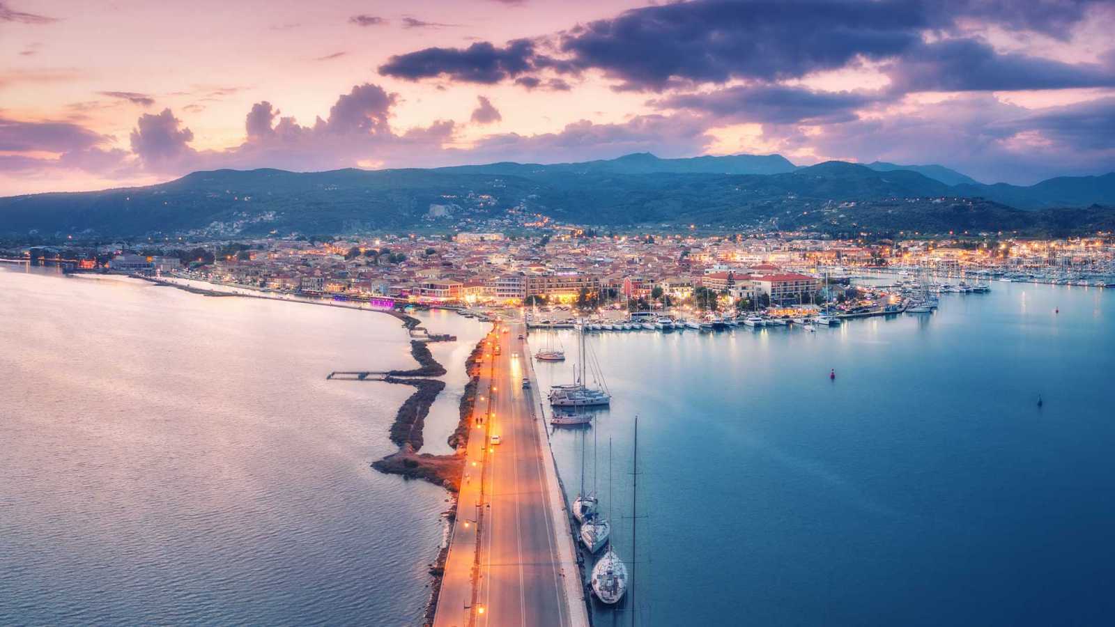 A serene night view of Lefkada, showcasing the island's vibrant nightlife and its status as one of Greece's real estate hotspots.